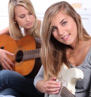 girls playing guitar to stay motivated - motivation